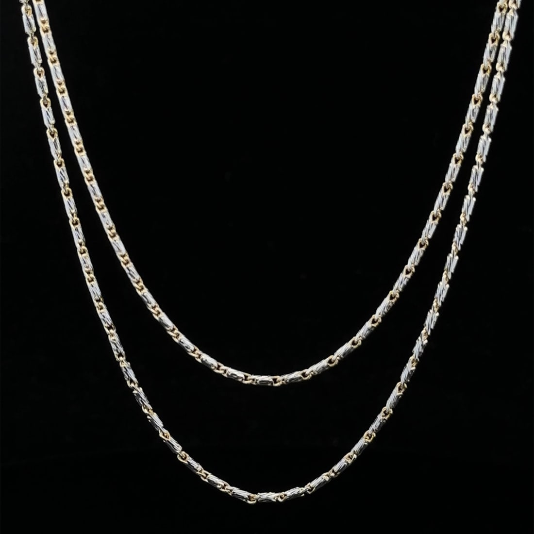 Two Tone 14K Gold 22 Inch Diamond Cut Fancy Link Necklace: Two Tone 14K Gold 22 Inch Diamond Cut Fancy Link Necklace This exquisite chain necklace features a stunning two-tone design crafted from solid 14K yellow and white gold. Measuring 22 inches in length,