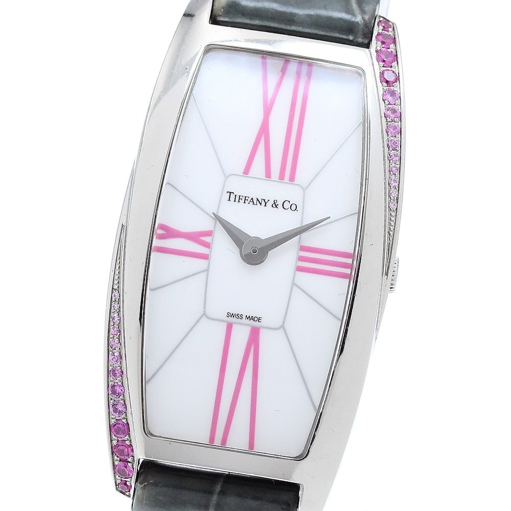 Tiffany Co Gemea Quartz Ladies Stainless Steel Watch: Tiffany Co Gemea Quartz Ladies Stainless Steel Watch This pre-owned Tiffany & Co. Gemea women's wristwatch features a stainless steel case and a white dial, paired with a leather strap. The watch oper