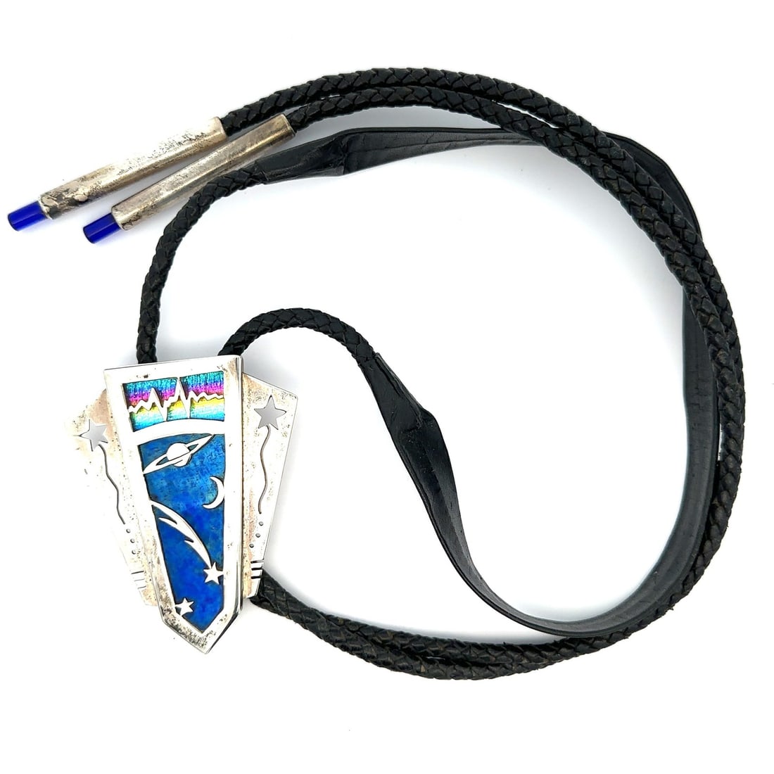 Sterling Silver Stained Glass Space Motif Bolo Tie With Black Leather Cord: Sterling Silver Stained Glass Space Motif Bolo Tie With Black Leather Cord This bolo tie features a galactic space theme with a stained glass centerpiece set in sterling silver. It includes a braided 