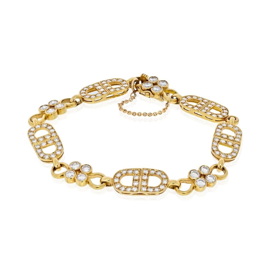 18K Yellow Gold Estate Diamond Anchor Link Bracelet 7 Carats: 18K Yellow Gold Estate Diamond Anchor Link Bracelet 7 Carats This exquisite 18K Yellow Gold anchor link bracelet features a stunning arrangement of full cut round diamonds, showcasing a total diamond 