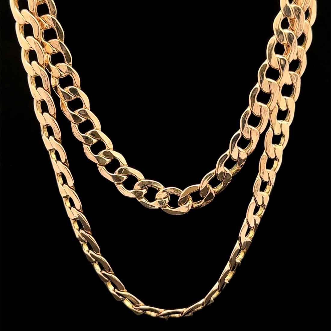 30 Inch 10k Rosy Yellow Gold Cuban Curb Chain Necklace with Lobster Clasp: 30 Inch 10k Rosy Yellow Gold Cuban Curb Chain Necklace with Lobster Clasp This unisex necklace features a 30-inch Cuban curb link chain crafted from solid 10k rosy yellow gold. The piece is designed w