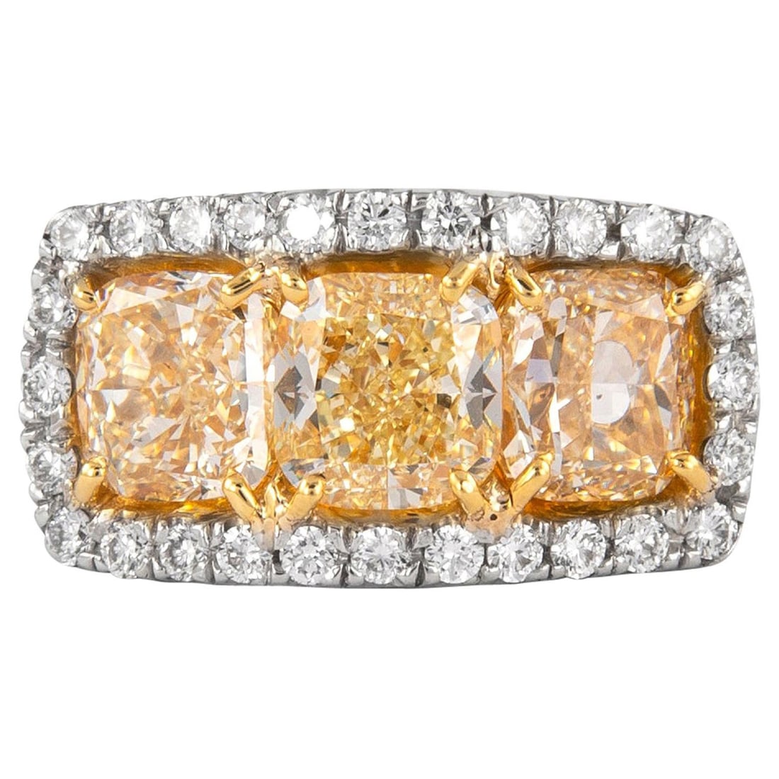 5.25 Carat 3-Stone Yellow Diamond Ring in 18K White and Yellow Gold: 5.25 Carat 3-Stone Yellow Diamond Ring in 18K White and Yellow Gold This stunning 3-stone yellow diamond ring showcases a total diamond weight of 5.25 carats, featuring three exquisite cushion-cut yel