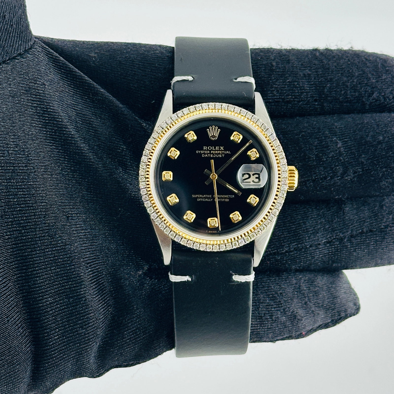 Rolex Datejust Ref 1601 Mens Watch With Aftermarket Black Diamond Dial and Leather Strap: Rolex Datejust Ref 1601 Mens Watch With Aftermarket Black Diamond Dial and Leather Strap This men's Rolex Datejust features an aftermarket black dial with yellow diamond markers, paired with an afterm