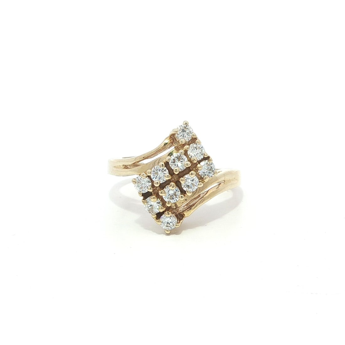 14k Yellow Gold .50ctw Diamond Bypass Cocktail Ring: 14k Yellow Gold .50ctw Diamond Bypass Cocktail Ring This exquisite cocktail ring showcases a stunning bypass design crafted from solid 14k yellow gold. It features a total of 10 natural diamonds, each
