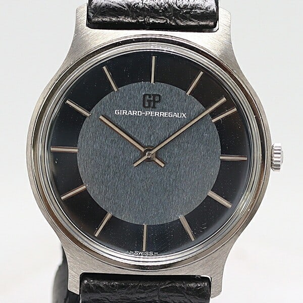 Girard Perregaux 9709MA Swiss Men's Wristwatch: Girard Perregaux 9709MA Swiss Men's Wristwatch This is a pre-owned Girard Perregaux 9709MA men's wristwatch, crafted in Switzerland. The watch is in good condition with minor damage and stains. It is 