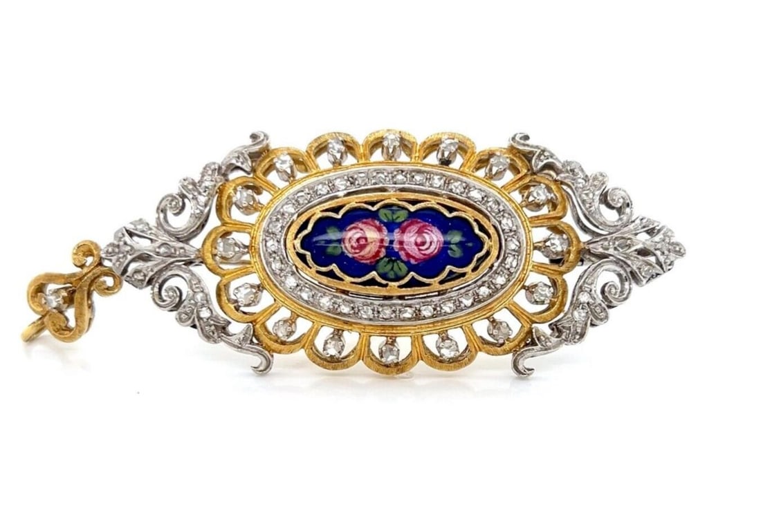 Vintage Unbranded Porcelain Brooch Pendant in 18k Gold and Silver: Vintage Unbranded Porcelain Brooch Pendant in 18k Gold and Silver This vintage estate brooch pendant is crafted in 18k yellow gold and silver and features a hand-painted porcelain floral plaque with p