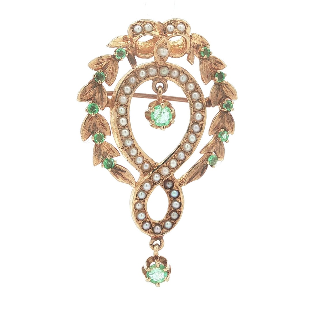 Victorian Revival 14k Gold Pendant Brooch with Emeralds and Seed Pearls: Victorian Revival 14k Gold Pendant Brooch with Emeralds and Seed Pearls This Victorian Revival pendant and brooch features an infinity wreath bow design crafted in solid 13-14K yellow gold. The piece 