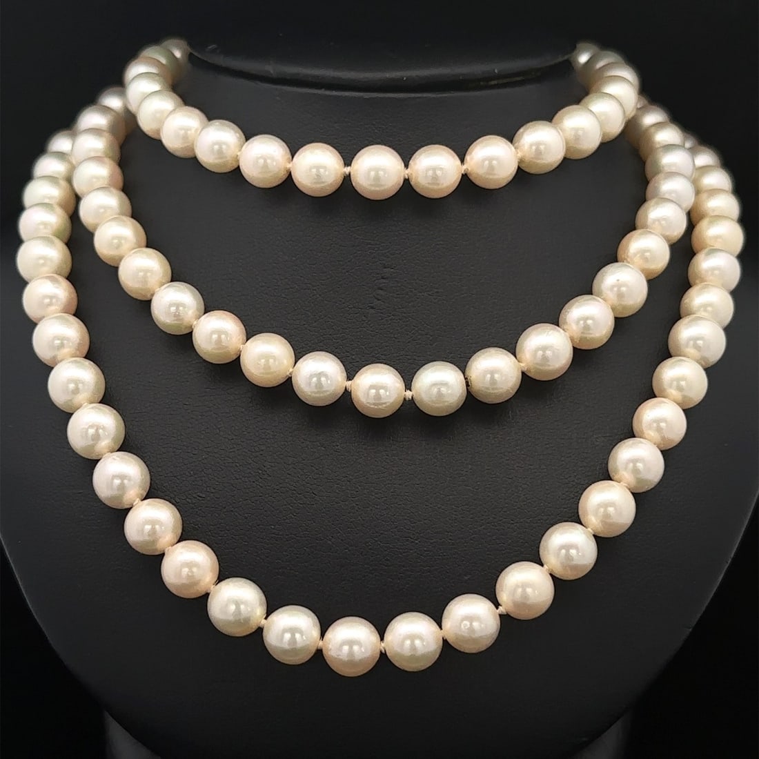 Vintage 51 Inch Adjustable Pearl Necklace 7.5-8mm Hidden Clasps: Vintage 51 Inch Adjustable Pearl Necklace 7.5-8mm Hidden Clasps Discover this stunning vintage 51-inch long slip-on pearl necklace, crafted from genuine cultured pearls. This elegant piece features ro