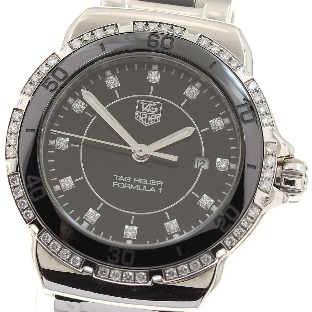 TAG Heuer Formula 1 Quartz Women's Diamond Bezel Watch: TAG Heuer Formula 1 Quartz Women's Diamond Bezel Watch This is a TAG HEUER Formula 1 WAH1312 women's wristwatch featuring a quartz movement and a diamond-set bezel. The watch is crafted in Switzerland