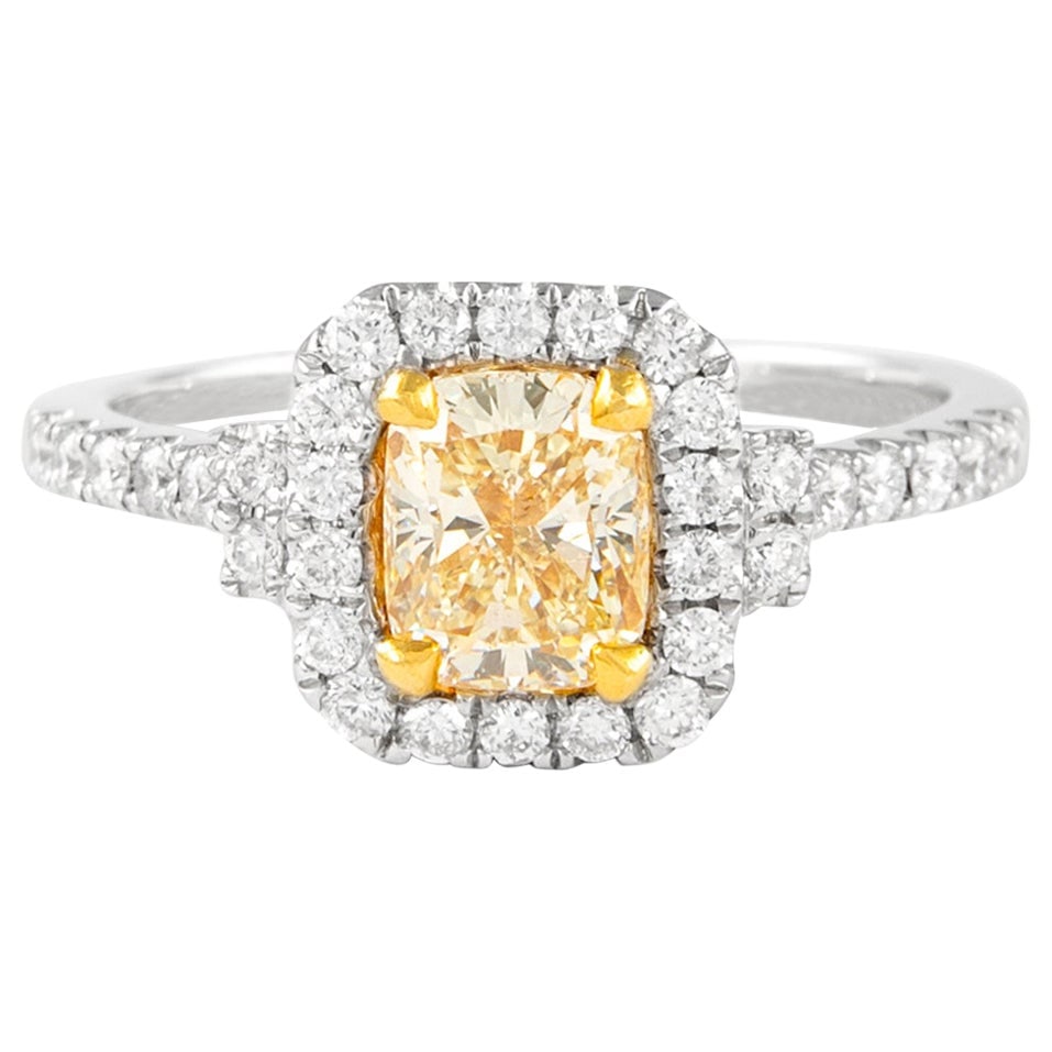 1.47ct Fancy Yellow Cushion Diamond Halo Ring 18k: 1.47ct Fancy Yellow Cushion Diamond Halo Ring 18k This stunning contemporary ring features a 1.47 ct Fancy Yellow cushion cut diamond, graded SI1 clarity, and is EGL certified. The diamond is beautifu