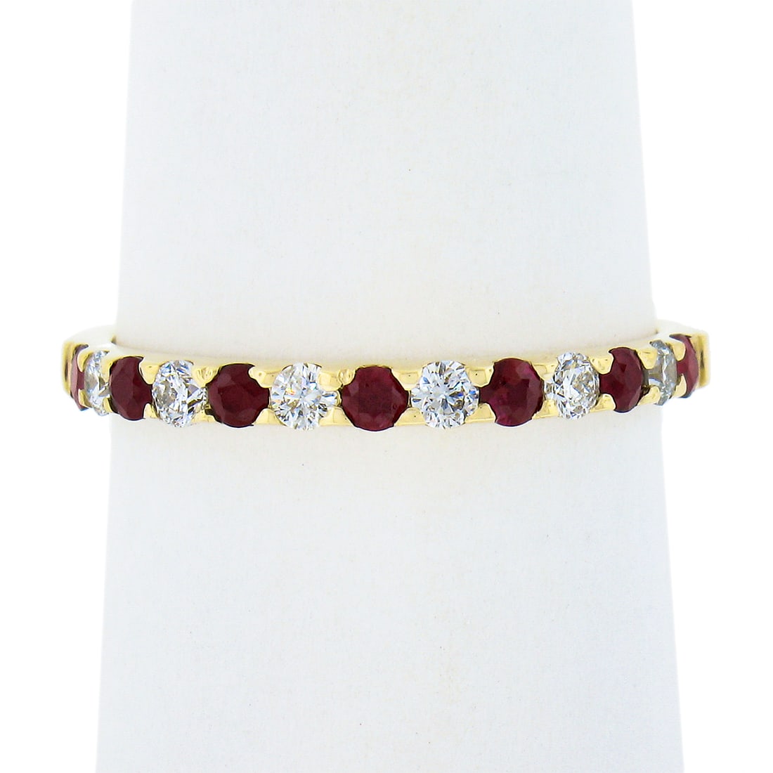 14K Yellow Gold Ruby Diamond Stackable Band Ring 0.53ct: 14K Yellow Gold Ruby Diamond Stackable Band Ring 0.53ct This exquisite 14K solid yellow gold stackable band ring features an alternating design of vibrant red rubies and sparkling diamonds. With a tot