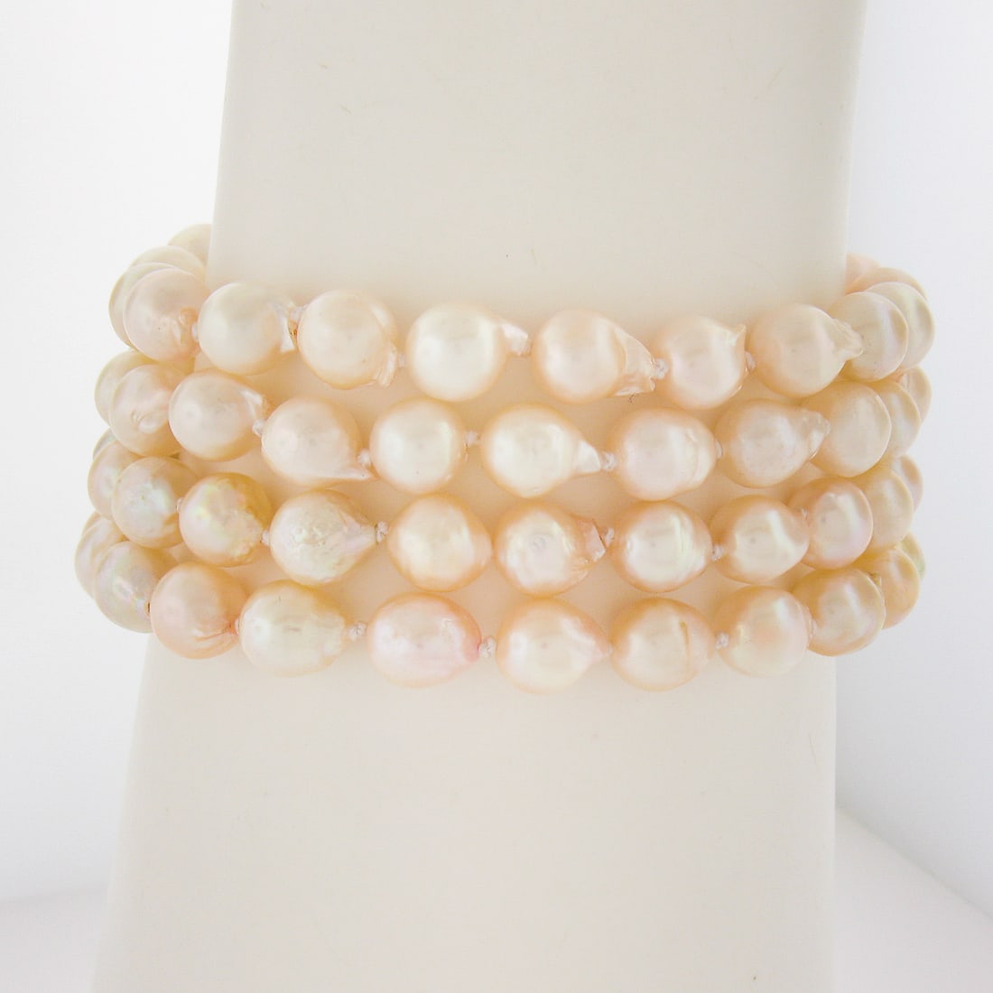 Stunning 4 Row Cultured Pearl Bracelet 14k Gold Multi Stone Clasp: Stunning 4 Row Cultured Pearl Bracelet 14k Gold Multi Stone Clasp This exquisite 6.75" 4-row strand bracelet features beautiful 6.8mm cultured pearls, elegantly complemented by a 14k yellow gold clasp