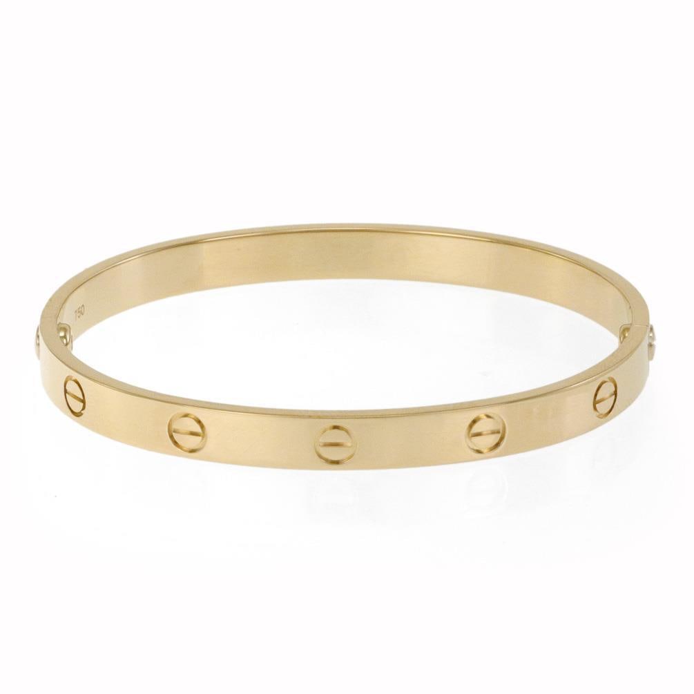Cartier Love Collection 18k Yellow Gold Bangle Bracelet with Screwdriver & Paper: Cartier Love Collection 18k Yellow Gold Bangle Bracelet with Screwdriver & Paper This iconic authentic bangle bracelet from Cartier's Love Collection is expertly crafted from 18k yellow gold, featurin