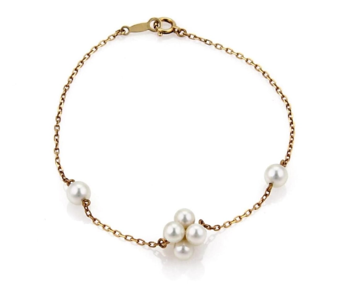 Mikimoto Akoya Pearl Cluster Charm Bracelet in 18k Yellow Gold: Mikimoto Akoya Pearl Cluster Charm Bracelet in 18k Yellow Gold This Mikimoto bracelet features Akoya pearls in a cluster charm chain design crafted in 18k yellow gold. It is signed, marked with M K18 