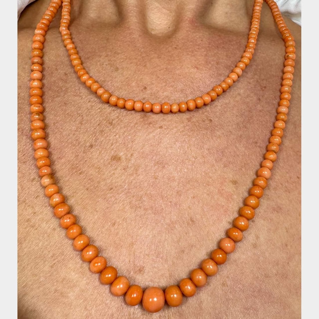 1960's 14K Gold Graduated Coral Necklace 56 inches 62.2 grams: 1960's 14K Gold Graduated Coral Necklace 56 inches 62.2 grams This stunning 1960's graduated coral necklace is crafted from 14K gold and features beautifully natural coral beads that range in size fro
