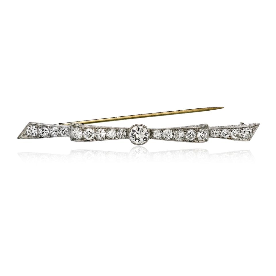 Art Deco Platinum Bow Brooch with 2.5 Carat Old-Cut Diamonds: Art Deco Platinum Bow Brooch with 2.5 Carat Old-Cut Diamonds This exquisite Art Deco brooch features a stunning bow design, crafted from high-quality platinum. It is elegantly adorned with 19 old-cut 