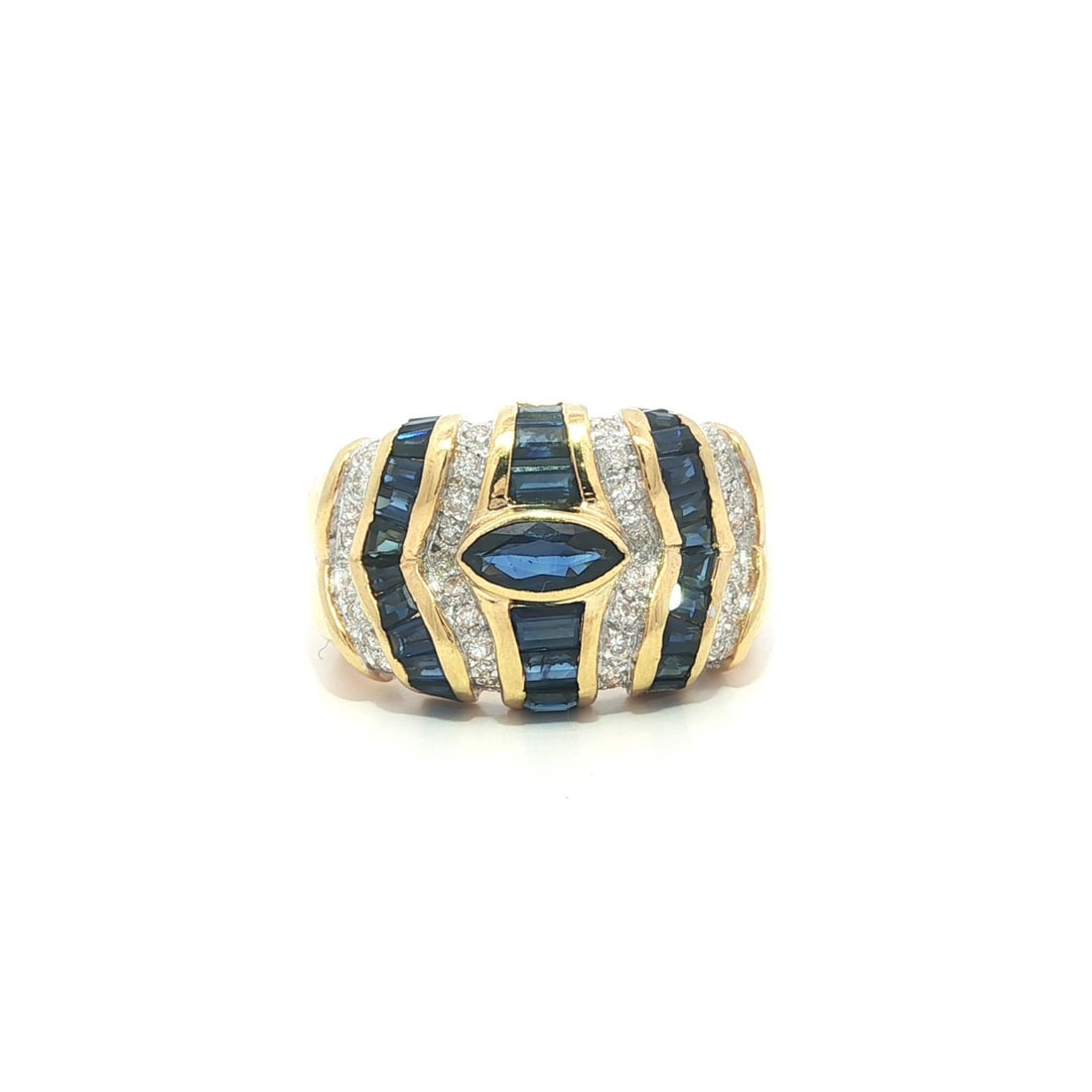 Wide 18k Yellow Gold Blue Sapphire Baguette Marquise and Diamond Band Ring: Wide 18k Yellow Gold Blue Sapphire Baguette Marquise and Diamond Band Ring This wide band ring features 31 natural sapphires, including 30 baguette-cut and 1 marquise-cut stones, set in solid 18k yell