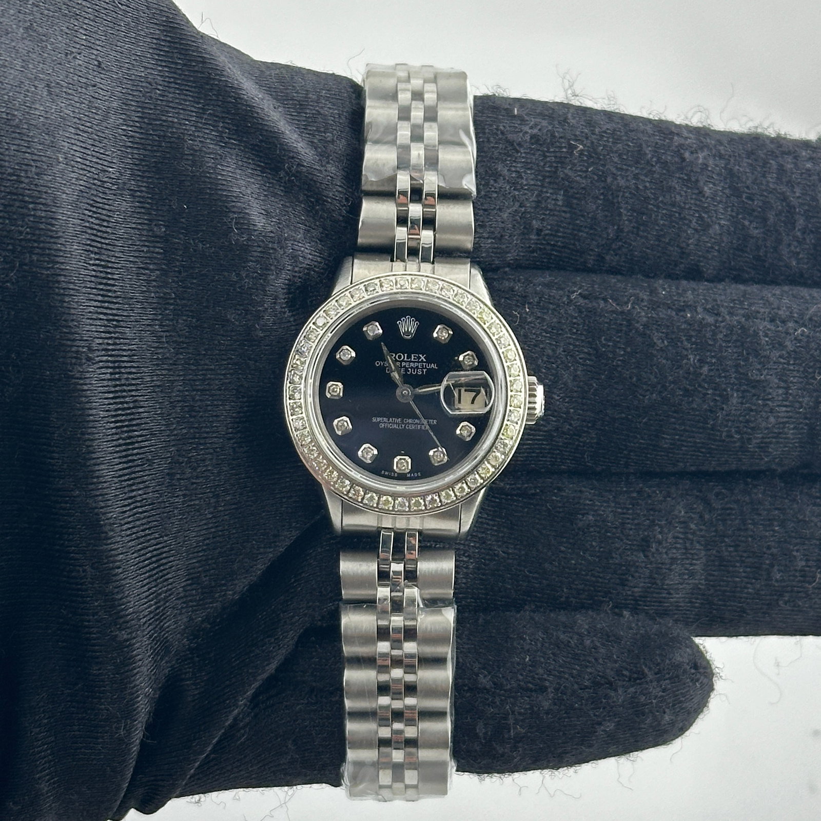 Ladies Rolex Datejust 6517 Aftermarket Black Diamond Dial Jubilee Bracelet: Ladies Rolex Datejust 6517 Aftermarket Black Diamond Dial Jubilee Bracelet This ladies Rolex Datejust features an aftermarket black diamond dial and a pave diamond bezel. It is equipped with an afterm