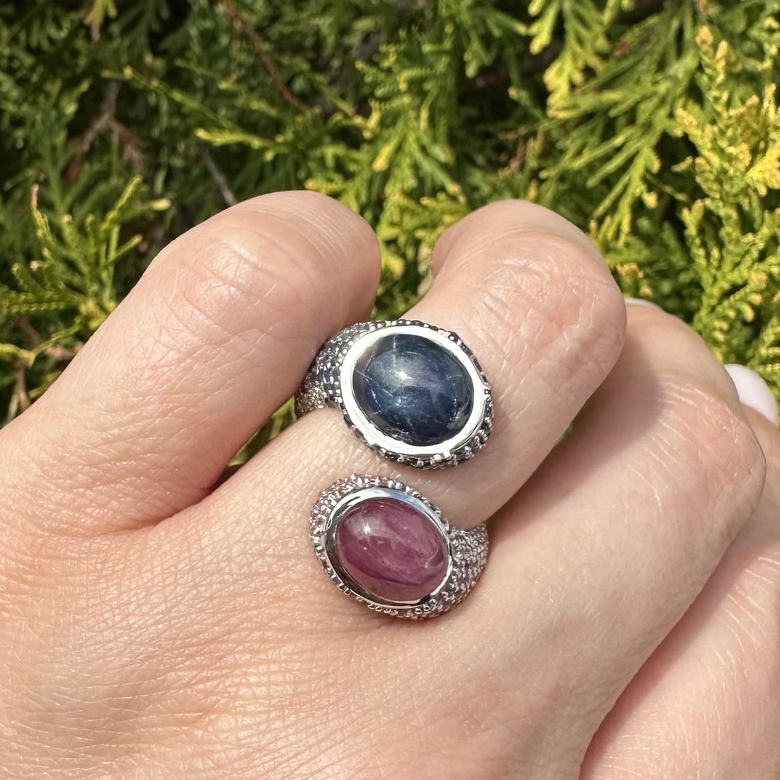 Serpent Bypass Ring in 18k White Gold with Star Sapphire Pink and Diamond Accents: Serpent Bypass Ring in 18k White Gold with Star Sapphire Pink and Diamond Accents This women's bypass ring features a striking serpent design crafted in solid 18k white gold. The centerpiece is a natu