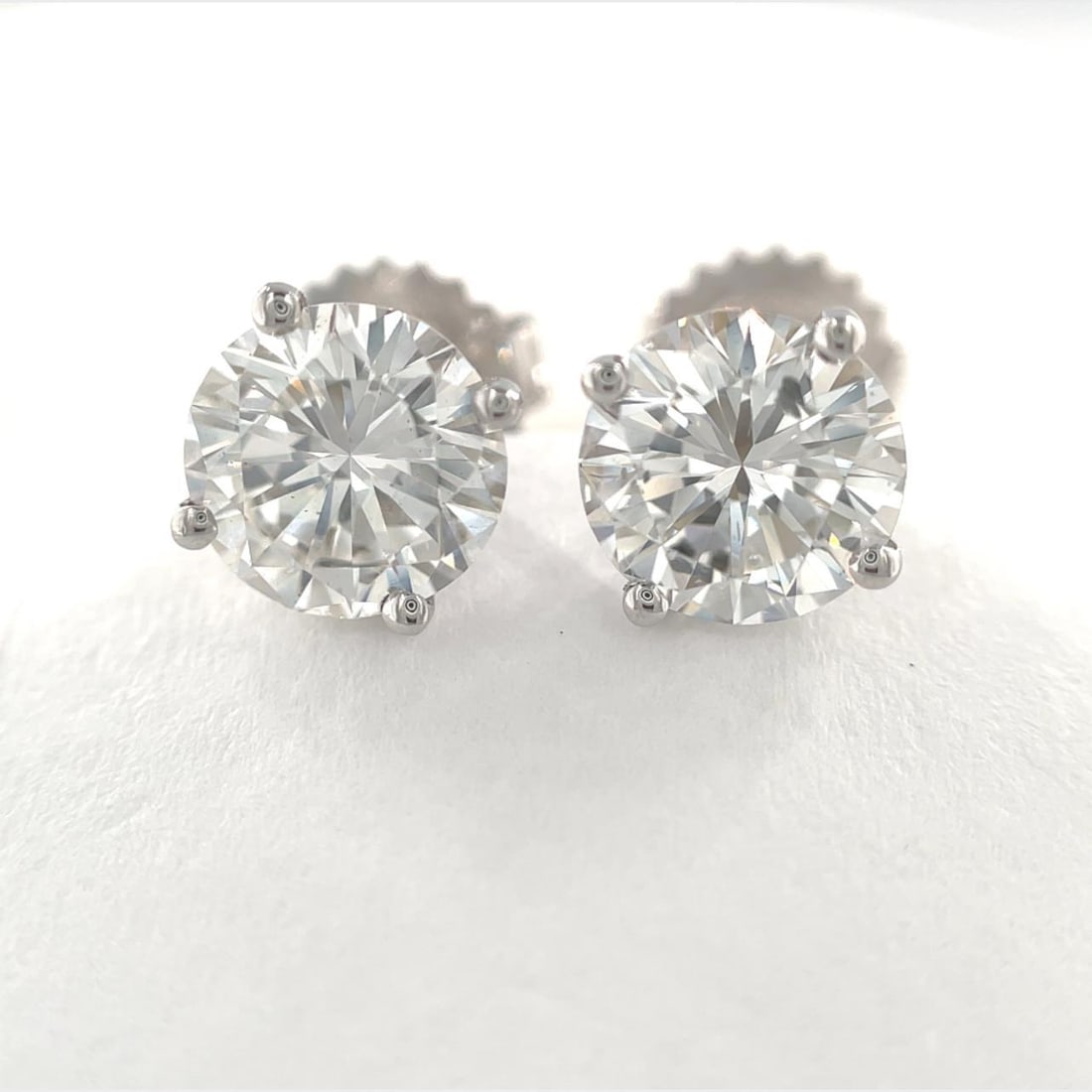 GIA Certified 2.19ct Round Diamond Stud Earrings 14k White Gold: GIA Certified 2.19ct Round Diamond Stud Earrings 14k White Gold Elevate your jewelry collection with this exquisite pair of round brilliant diamond stud earrings, meticulously crafted from 14k white g