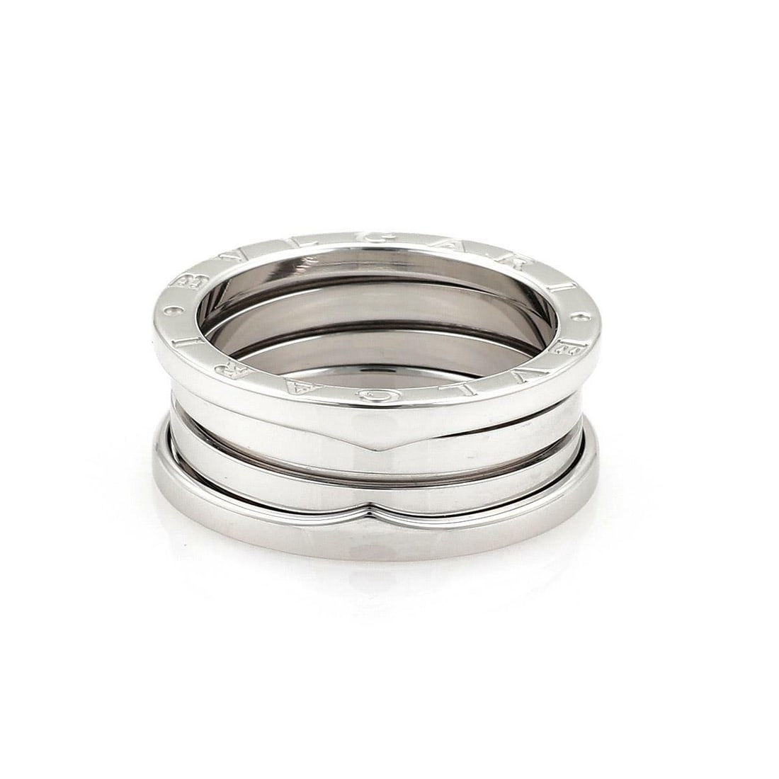 Bvlgari B Zero-1 18k White Gold Flex Band Ring US 4.25: Bvlgari B Zero-1 18k White Gold Flex Band Ring US 4.25 Discover the elegance of the Bvlgari B Zero-1 Band Ring, expertly crafted from 18k white gold. This exquisite ring features a unique flex design 