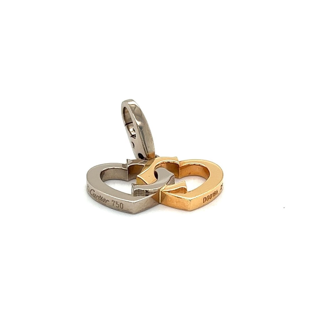 Cartier C Hearts Pendant in 18k White and Pink Gold: Cartier C Hearts Pendant in 18k White and Pink Gold This Cartier C Hearts charm pendant is crafted in 18k white gold and pink gold with an interlaced heart motif. It is an original, signed piece from 