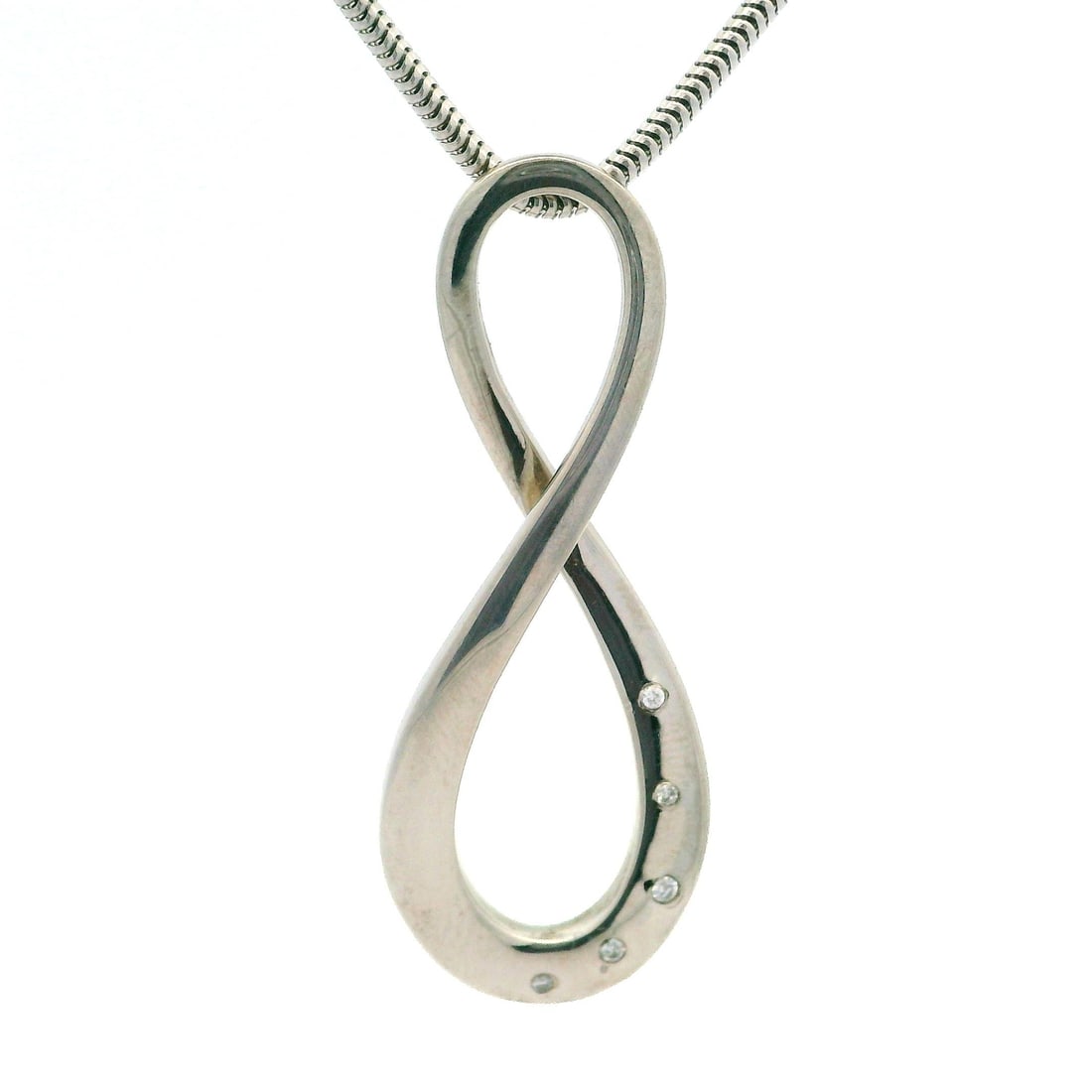 Sterling Silver Diamond Infinity Slide Pendant Necklace 0.05ctw: Sterling Silver Diamond Infinity Slide Pendant Necklace 0.05ctw This exquisite necklace features a long infinity slide pendant adorned with five natural genuine diamonds, each showcasing a round brill
