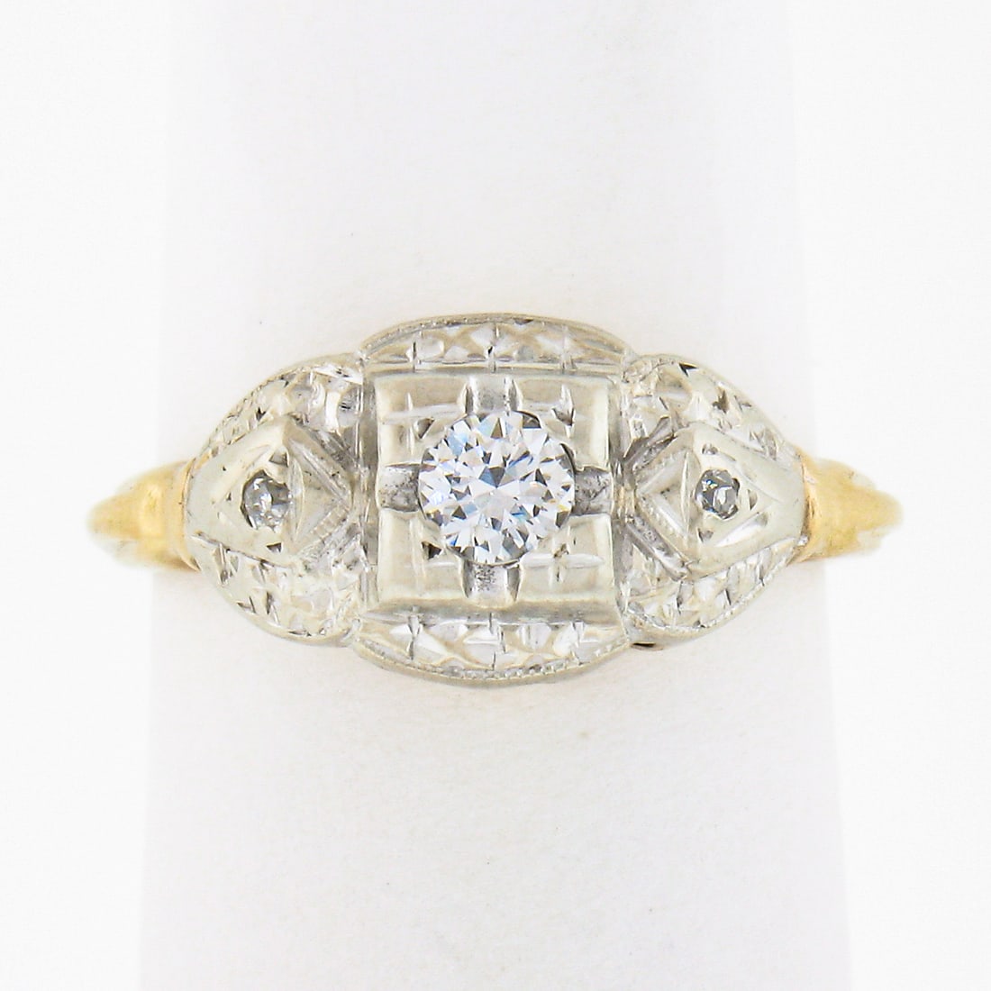 Art Deco 14K Two Tone Gold Diamond Accent Ring 0.17 ctw: Art Deco 14K Two Tone Gold Diamond Accent Ring 0.17 ctw Antique Art Deco original ring crafted in solid 14k two-tone gold with a domed top design. This handmade solitaire with accents features 3 natur