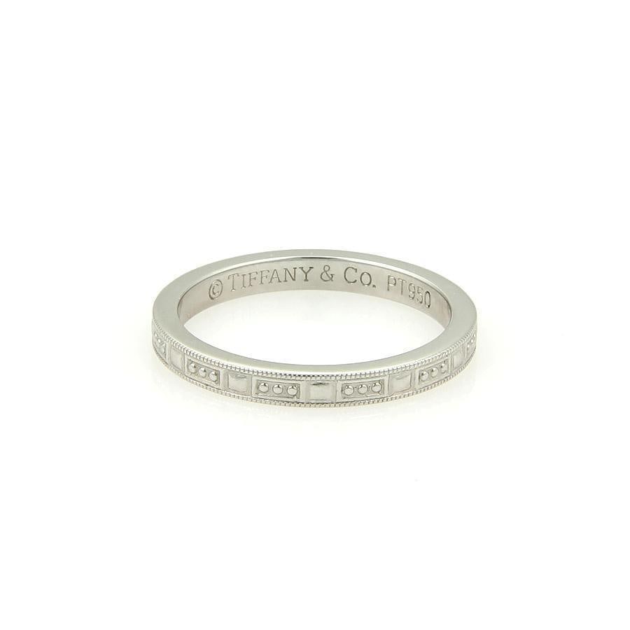 Tiffany & Co. Platinum Ring with Milgrain Bead Design Size 5.5: Tiffany & Co. Platinum Ring with Milgrain Bead Design Size 5.5 This exquisite wedding band from Tiffany & Co. is a testament to timeless elegance. Crafted in platinum, it features a delicate milgrain 