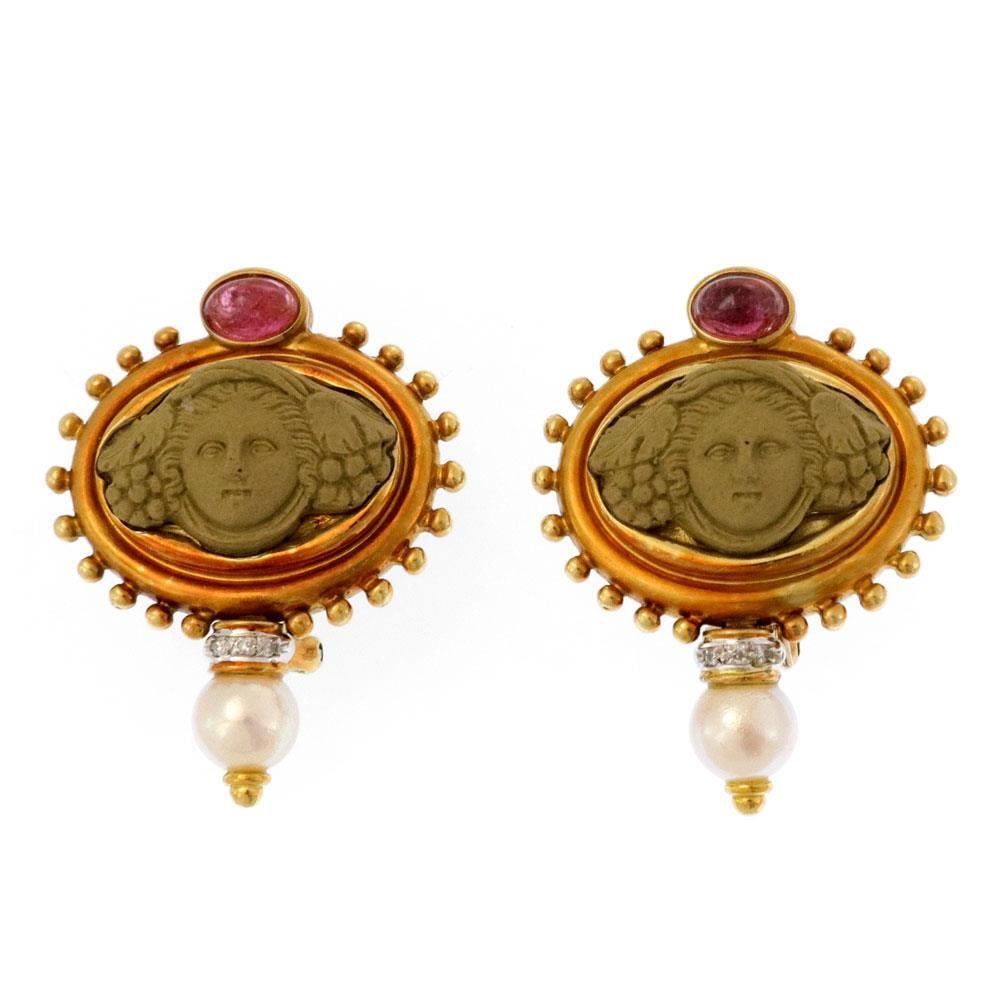 Estate 18k Gold Lava Cameo Earrings with Tourmaline Diamonds and Pearls: Estate 18k Gold Lava Cameo Earrings with Tourmaline Diamonds and Pearls These stunning estate earrings are expertly crafted from 18k yellow gold, showcasing a unique oval frame adorned with fine beads