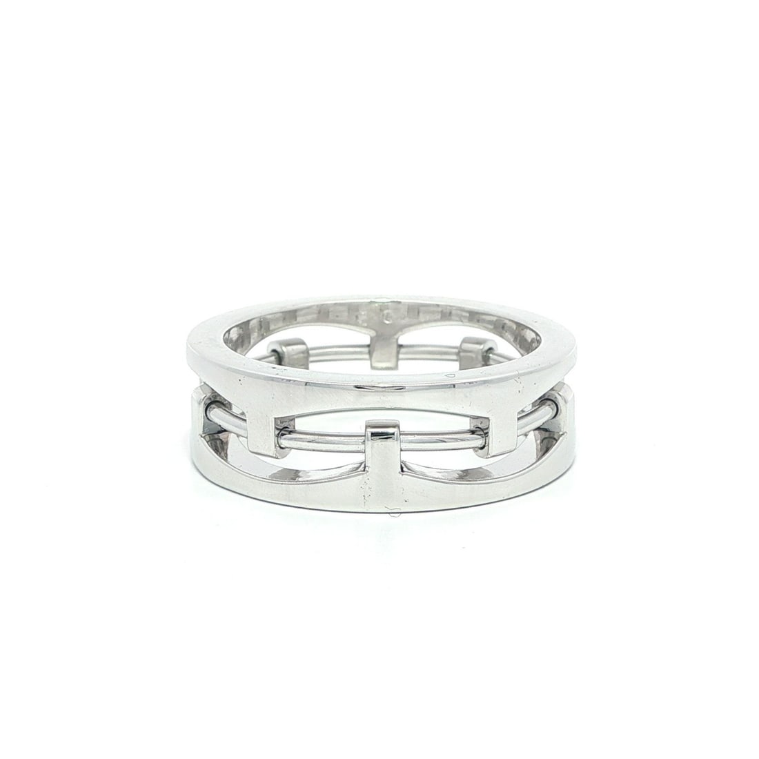 Men's 18k White Gold 7.6mm Open Work Band Ring: Men's 18k White Gold 7.6mm Open Work Band Ring This striking band ring is crafted from solid 18k white gold, showcasing a unique open work design. With a width of 7.6mm and a height of 2.5mm, it offer
