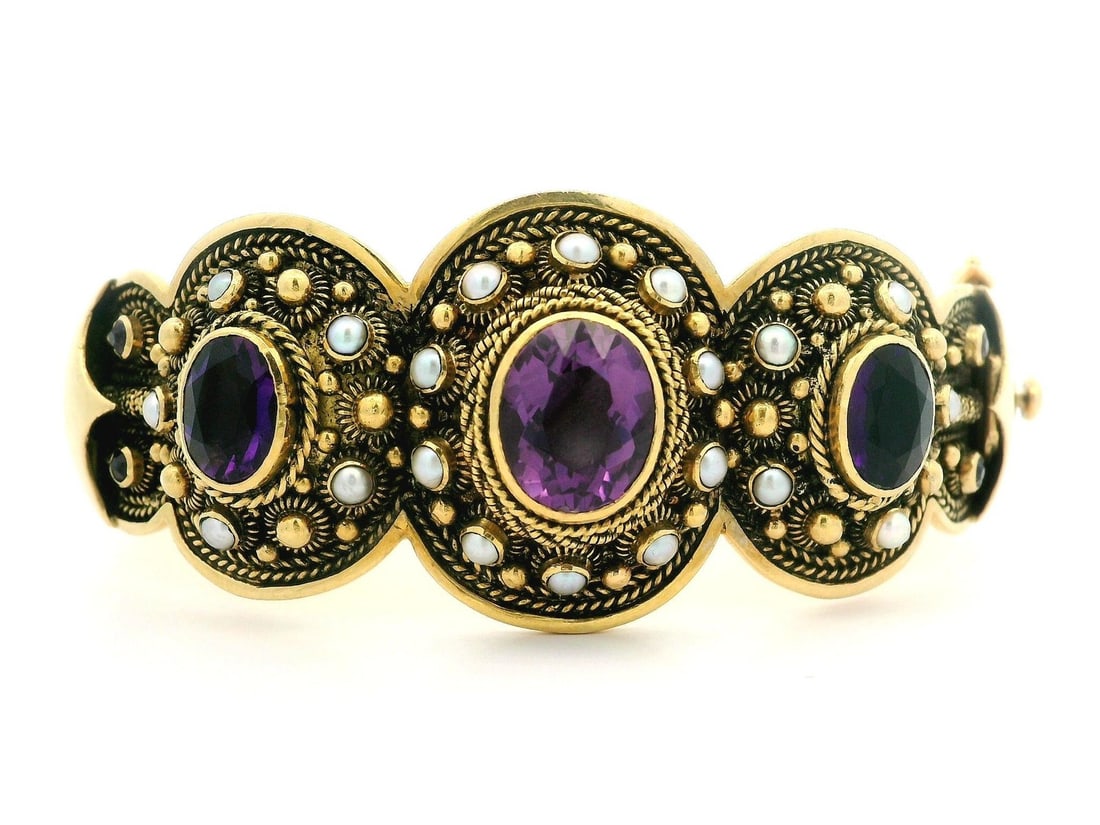 Vintage 18k Yellow Gold Hinged Bangle Bracelet with Amethyst and Pearl: Vintage 18k Yellow Gold Hinged Bangle Bracelet with Amethyst and Pearl This exquisite vintage bangle bracelet showcases a stunning combination of natural amethyst and cultured pearls, all beautifully 