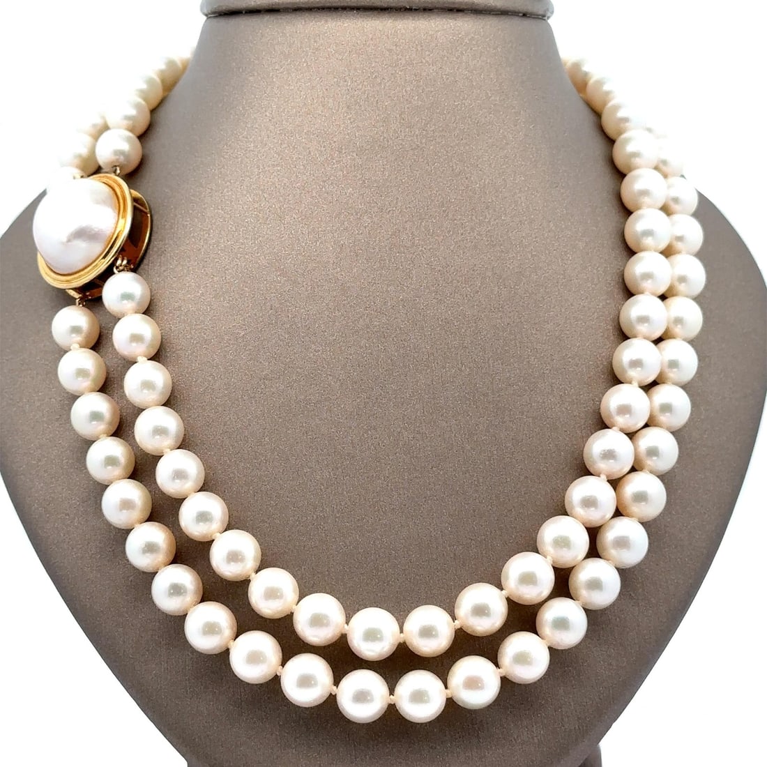 GIA Certified Dual Strand Akoya Pearl Necklace 28" 14k Gold Clasp: GIA Certified Dual Strand Akoya Pearl Necklace 28" 14k Gold Clasp This exquisite dual strand necklace features 141 genuine cultured saltwater Akoya pearls, meticulously crafted in a round shape with a