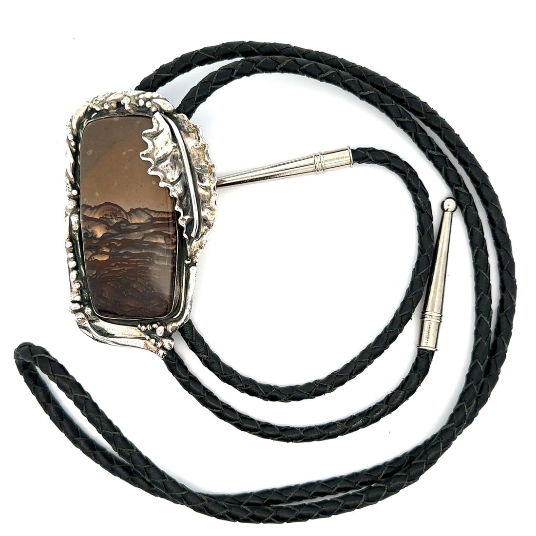 Stan Davidson Navajo Sterling Silver Jasper Leather Bolo Tie: Stan Davidson Navajo Sterling Silver Jasper Leather Bolo Tie This vintage Navajo bolo tie by Stan Davidson features a custom-cut, natural jasper stone with a mountain scape motif, bezel set in sterlin