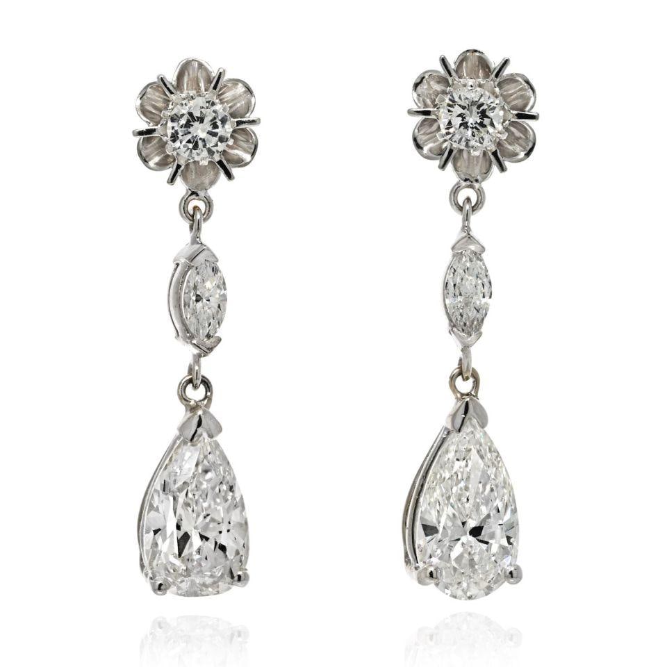 14K White Gold 4.42ct Diamond Drop Earrings Pear Marquise Cut: 14K White Gold 4.42ct Diamond Drop Earrings Pear Marquise Cut These exquisite earrings feature a stunning combination of pear cut and marquise diamonds, elegantly set in 14K white gold. The earrings s