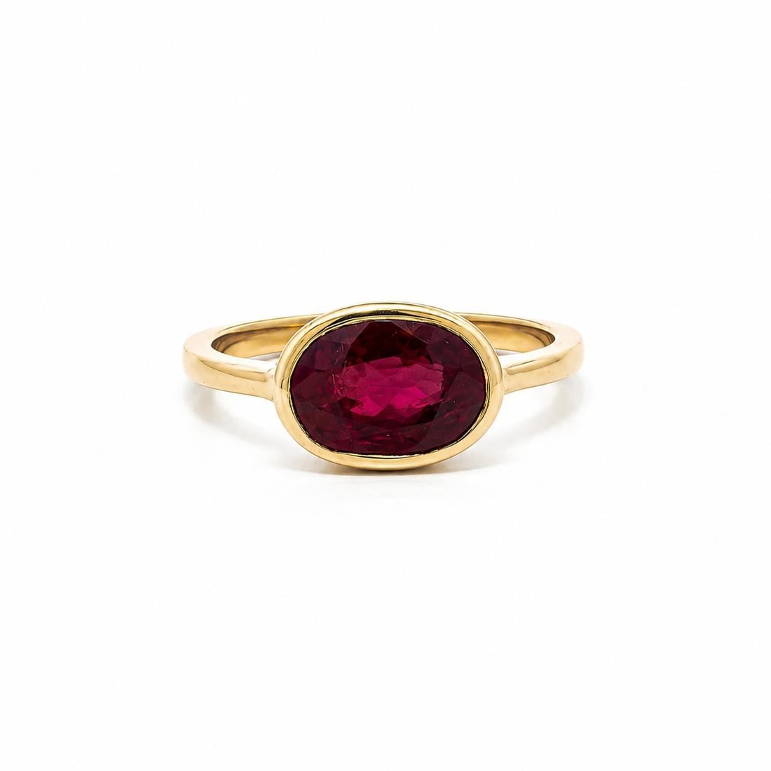Unbranded 18k Yellow Gold East West Oval Burma Ruby Ring SSEF 2.56ct: Unbranded 18k Yellow Gold East West Oval Burma Ruby Ring SSEF 2.56ct Vintage ruby ring featuring a natural Burma (Myanmar) no-heat ruby in an east-west bezel setting. The ring is crafted in solid 18k 