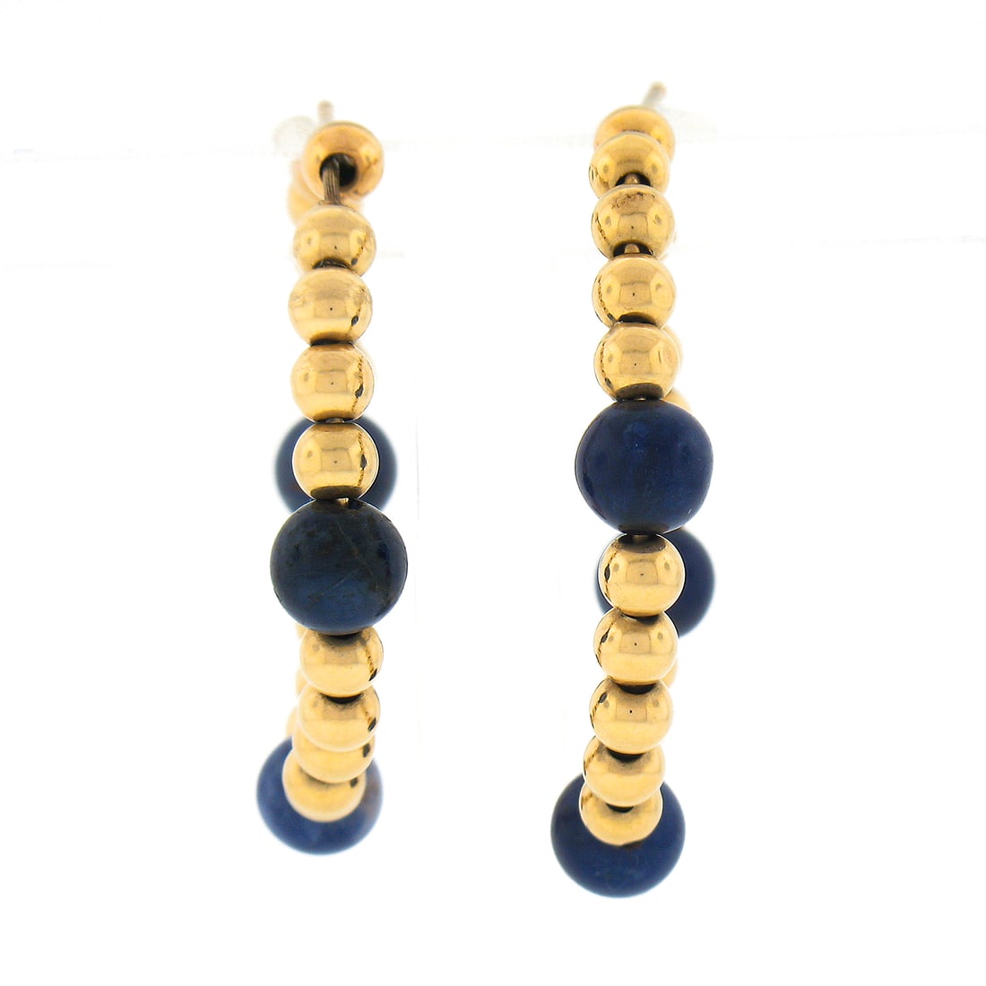 Vintage 14k Yellow Gold Hoop Earrings with Blue Lapis Beads: Vintage 14k Yellow Gold Hoop Earrings with Blue Lapis Beads These exquisite vintage polished earrings feature a stunning combination of 14k yellow gold and natural blue lapis lazuli beads. Designed in