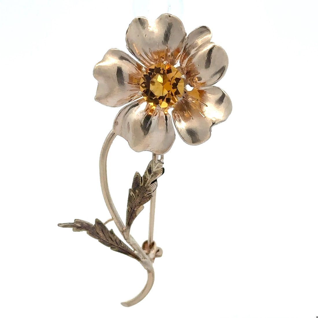 10k Yellow Gold Flower Brooch with Yellow Stone Detail: 10k Yellow Gold Flower Brooch with Yellow Stone Detail This exquisite brooch features a stunning flower design crafted in solid 10k yellow gold, showcasing a vivid yellow stone in an old round cut. Th
