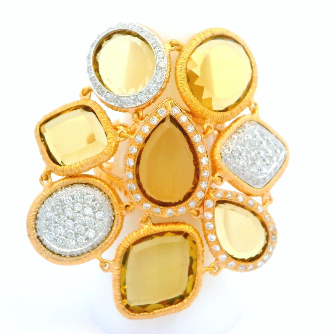 18k Two Tone Gold Citrine and Diamond Statement Ring: 18k Two Tone Gold Citrine and Diamond Statement Ring Make a bold statement with this exquisite 18k Two Tone Gold Portrait Citrine and Diamond Ring. Designed with a stunning centerpiece, this large fle
