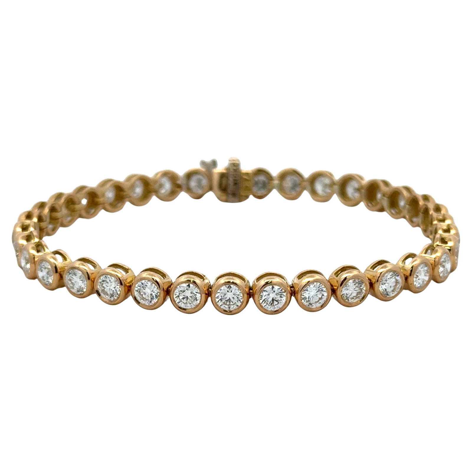 Harbor Diamonds 5.70 Carat Diamond Bezel Tennis Bracelet in 18K Yellow Gold: Harbor Diamonds 5.70 Carat Diamond Bezel Tennis Bracelet in 18K Yellow Gold This exquisite 18 karat yellow gold tennis bracelet features 35 round brilliant diamonds, totaling an impressive weight of 5