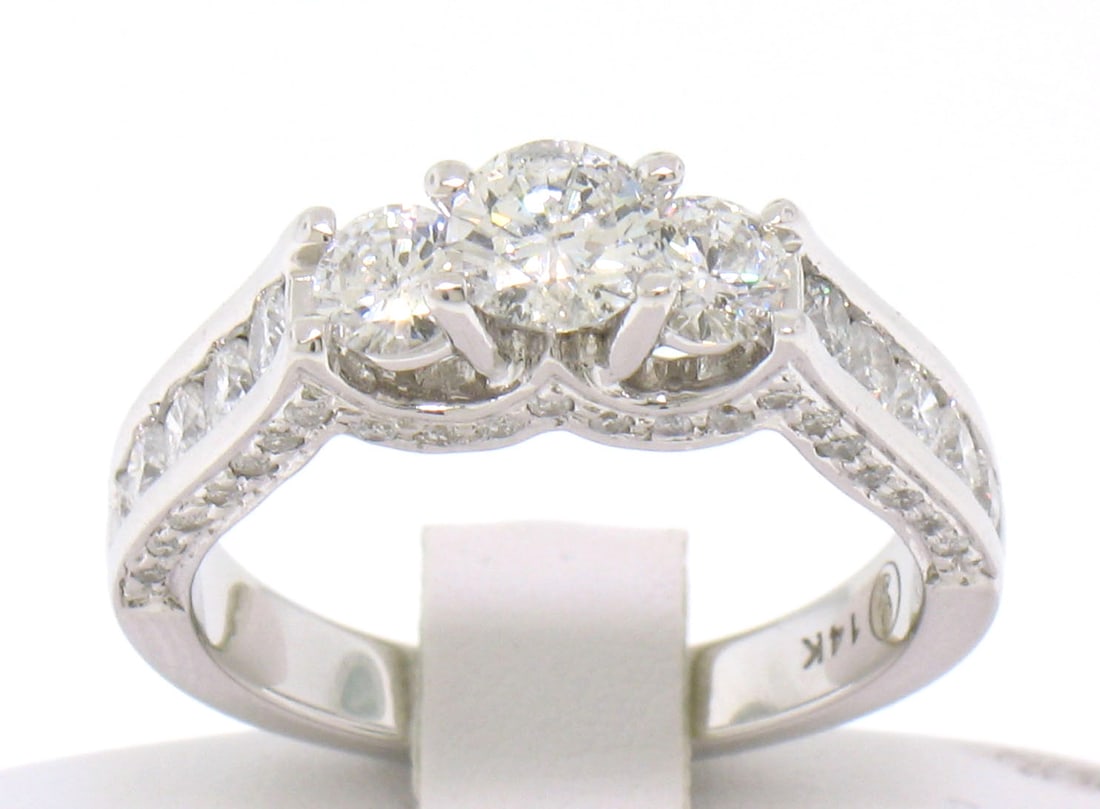 Designer 14k White Gold 1.85ct Diamond Three-Stone Engagement Ring: Designer 14k White Gold 1.85ct Diamond Three-Stone Engagement Ring This stunning engagement ring features a remarkable design crafted in 14k solid white gold. Showcasing a total diamond weight of appr