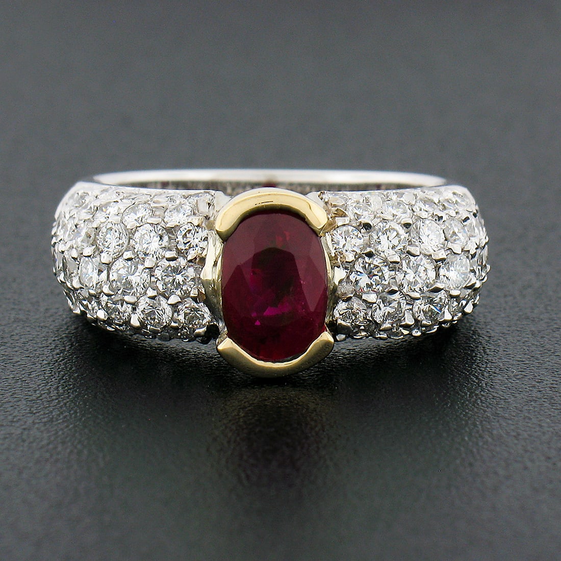 GIA Certified 14k Two Tone Gold 2.61ct Ruby Diamond Cocktail Ring: GIA Certified 14k Two Tone Gold 2.61ct Ruby Diamond Cocktail Ring This stunning cocktail ring showcases a GIA-certified natural ruby from Burma, elegantly set in solid 14k two-tone gold. The centerpie