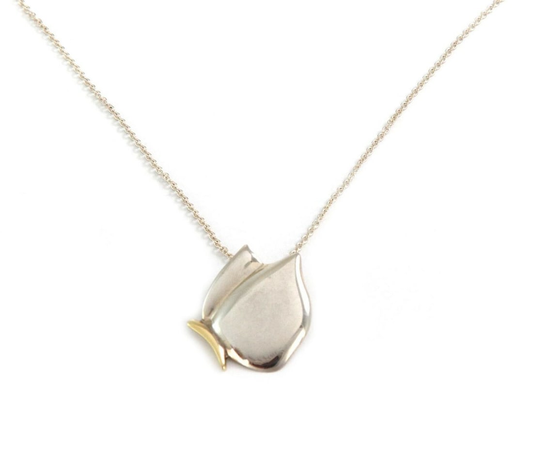 Tiffany & Co. Sterling Silver 18k Gold Butterfly Pendant with Chain: Tiffany & Co. Sterling Silver 18k Gold Butterfly Pendant with Chain This exquisite Tiffany & Co. Butterfly Pendant is a stunning piece of jewelry that showcases a unique butterfly design crafted from 