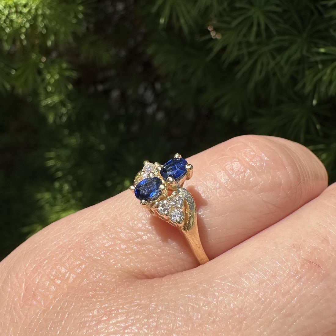 14k yellow gold sapphire diamond cluster moi et toi ring size 5.5: 14k yellow gold sapphire diamond cluster moi et toi ring size 5.5 This petite "Moi Et Toi" cocktail ring features a cluster design crafted in solid 14k yellow gold. The centerpiece showcases two natur