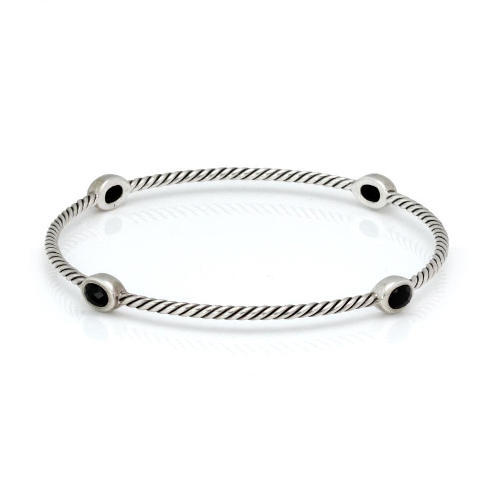 David Yurman Onyx Sterling Silver Cable Bangle with 4 Stations: David Yurman Onyx Sterling Silver Cable Bangle with 4 Stations This exquisite bangle from David Yurman showcases a timeless design crafted from sterling silver. The piece features a 2.3mm thick cable 