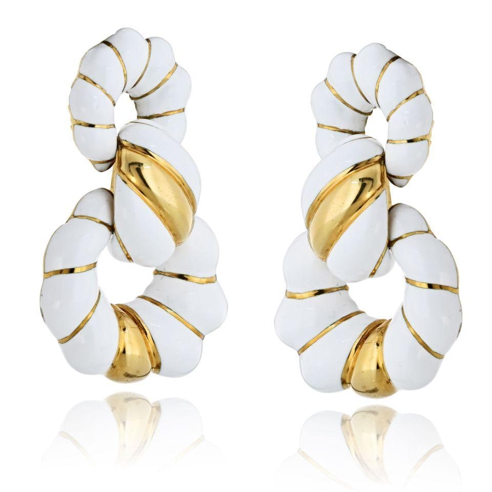 David Webb 18K Yellow Gold White Enamel Doorknocker Earrings 1.75 Inch: David Webb 18K Yellow Gold White Enamel Doorknocker Earrings 1.75 Inch Experience the bold sophistication of these David Webb 18K Yellow Gold and White Enamel Doorknocker Earrings. Crafted from solid 