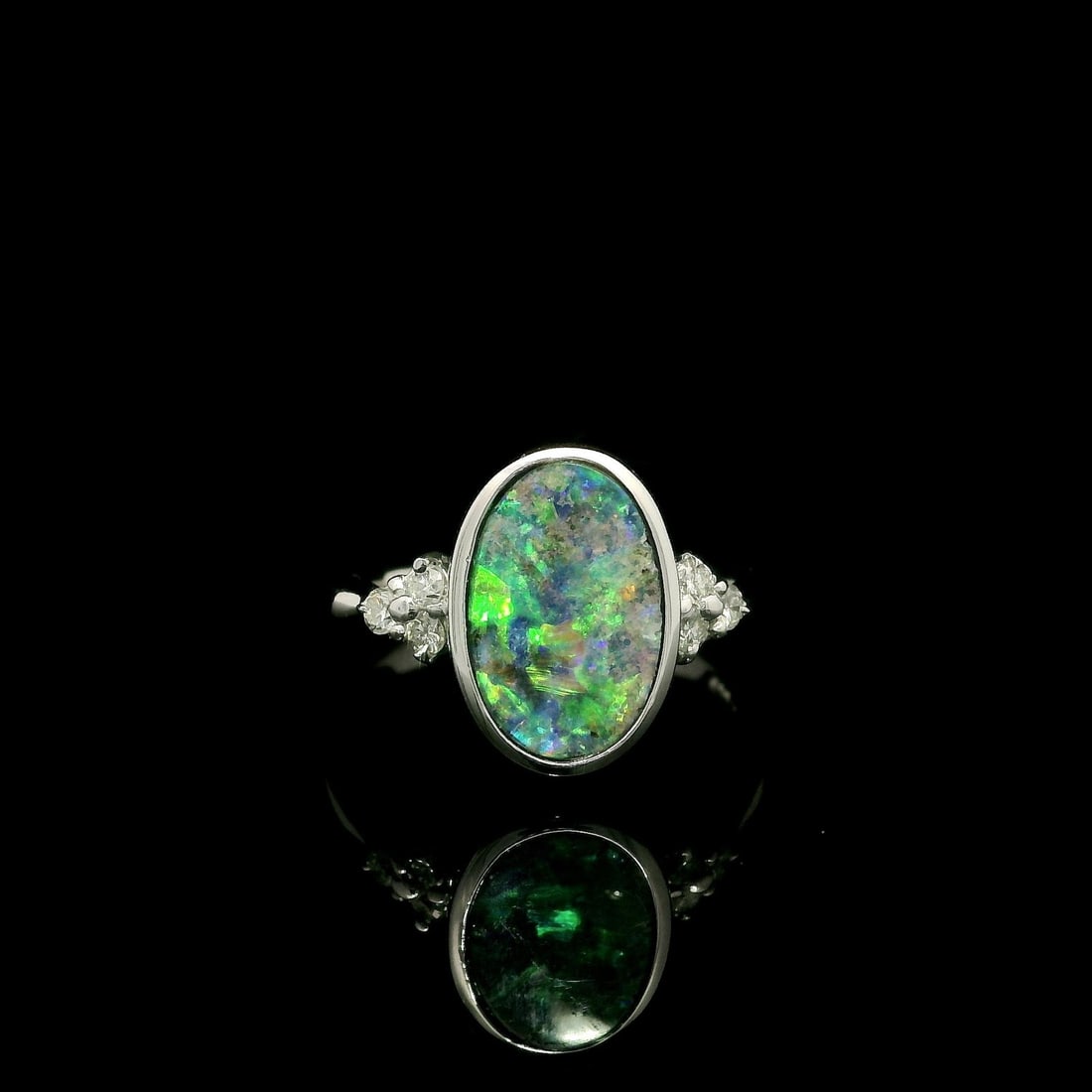 Platinum 2.29ctw Black Boulder Opal Diamond Cluster Cocktail Ring: Platinum 2.29ctw Black Boulder Opal Diamond Cluster Cocktail Ring This modern cocktail ring showcases an exquisite 2.29 carat total weight featuring a stunning natural genuine boulder opal at its cent