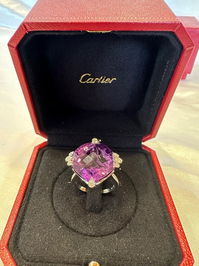 Cartier 18K White Gold Amethyst Diamond Ring with Boxes Size 7: Cartier 18K White Gold Amethyst Diamond Ring with Boxes Size 7 Presenting a stunning Cartier ring crafted from 18K white gold, featuring a striking amethyst center stone surrounded by 16 G color diamo