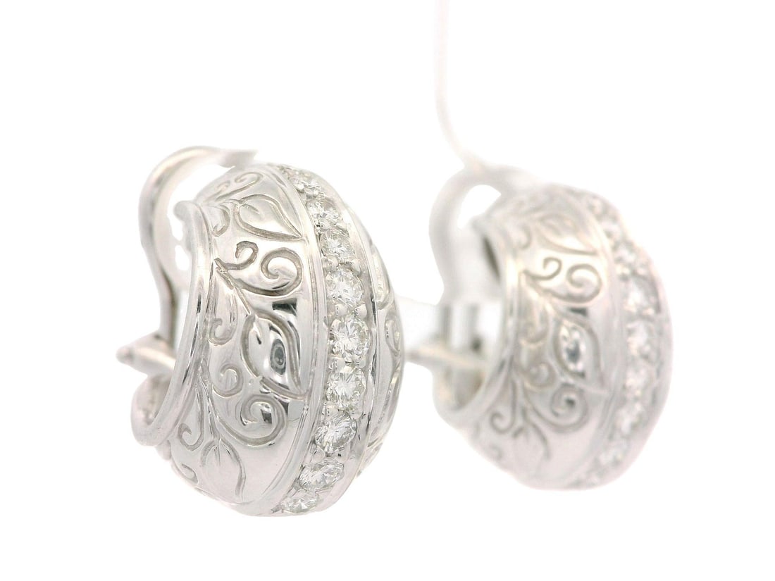 SeidenGang 18K White Gold Cuff Earrings with 0.40ct Diamonds: SeidenGang 18K White Gold Cuff Earrings with 0.40ct Diamonds Elevate your elegance with these exquisite cuff omega earrings crafted from solid 18k white gold. Featuring a stunning arrangement of 22 na