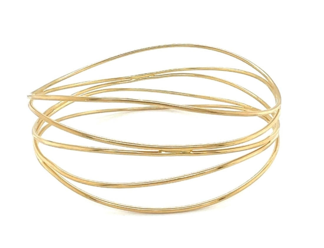 Tiffany & Co Elsa Peretti 18k Gold 5 Row Wire Wave Bangle: Tiffany & Co Elsa Peretti 18k Gold 5 Row Wire Wave Bangle This Tiffany & Co. Elsa Peretti bangle bracelet is crafted in 18k yellow gold and features a sculptural five-row wire wave design. It has an i